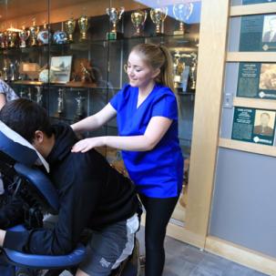Massage therapy students practice on volunteers.