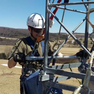 Torque-checking bolts on the Bergey tower 