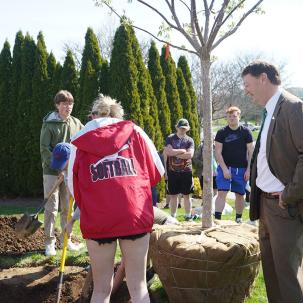 SUNY Morrisville President David Rogers oversees tree planting on Earth Day.