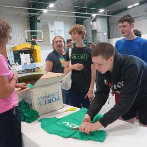 Student participate in a t-shirt upcycling activity during SUNY Morrisville's Earth Day Celebration.