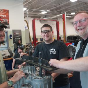 Morrisville Alum Dan Akers works with two Ford ASSET students.