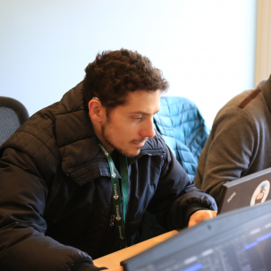 Two people working at computers.