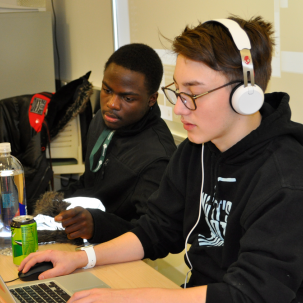 Two people working at computers.