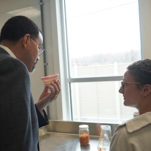 SUNY Chancellor John B. King visit students working in the commercial kitchen.