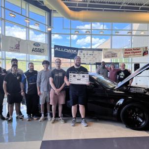 Auto champions pose with the Dodge Demon 