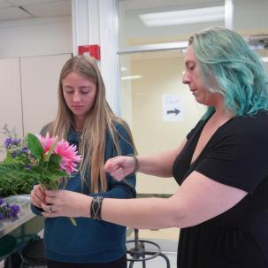 Nicole Johnson assists a student