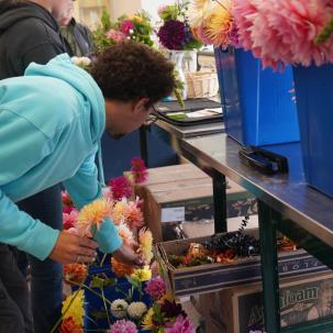 A student selects flowers