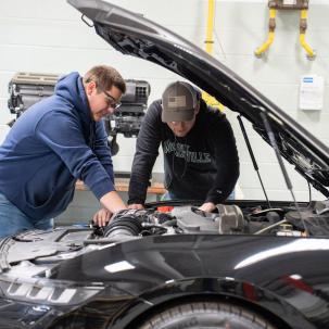Auto students work on the 2024 Mustang