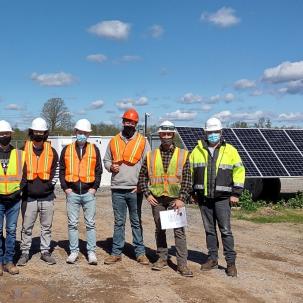Students in Assistant Professor Ryan Quinn’s Advanced Topics in Solar Photovoltaics class pose with 2013 SUNY Morrisville alumnus John Derouchey.