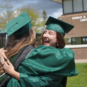 Grads hugging