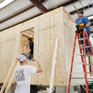 Students work on the house in lab