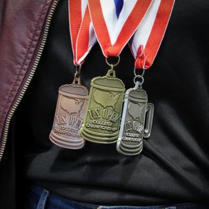 The bronze, silver and gold medal won by SUNY Morrisville during the 2018 U.S. Open College Beer Championship (Photo credit Sarah Marcellus, MAC Associate Graphic Designer).
