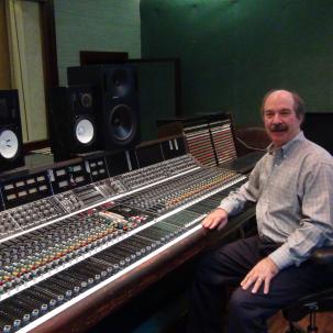 Larry Droppa in a recording studio with one of his API consoles