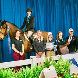 Student and coaches after winning national championship