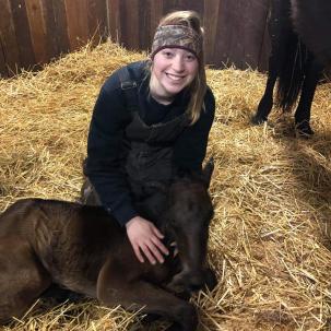 Student with a foal