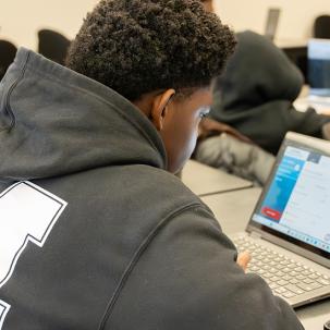 Introduction to Business (Professor Chris Scalzo) students were working on simulations (making decisions on pricing, production and quality)