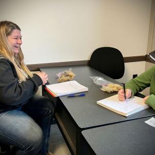 Students in Associate Professor Corey Hayes' Sheep Production and Management System class evaluate wool.