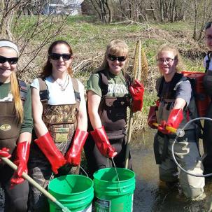 Environmental conservation students do field work.