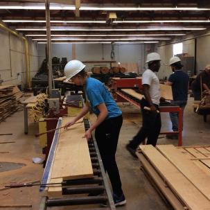 Multiple students work in the Wood Products Technology Center