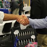 Shaking hands at a career fair.
